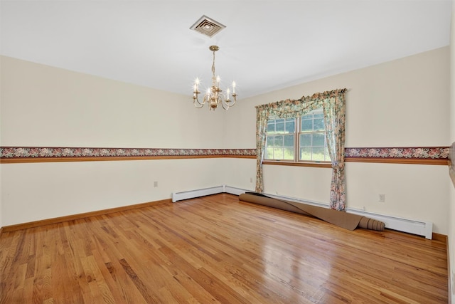 561 Toleman Rd, Rock Tavern, NY 12575 - unfurnished room with a chandelier, wood finished floors, and baseboard heating