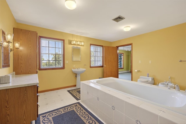 561 Toleman Rd, Rock Tavern, NY 12575 - full bath with a garden tub, a bidet, and baseboard heating