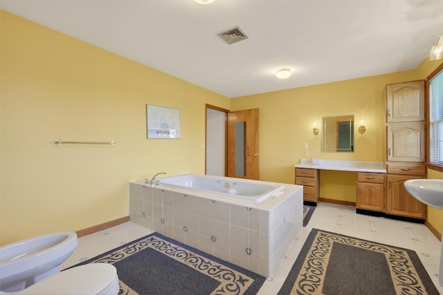 561 Toleman Rd, Rock Tavern, NY 12575 - full bath with a garden tub, tile patterned floors, vanity, and a bidet