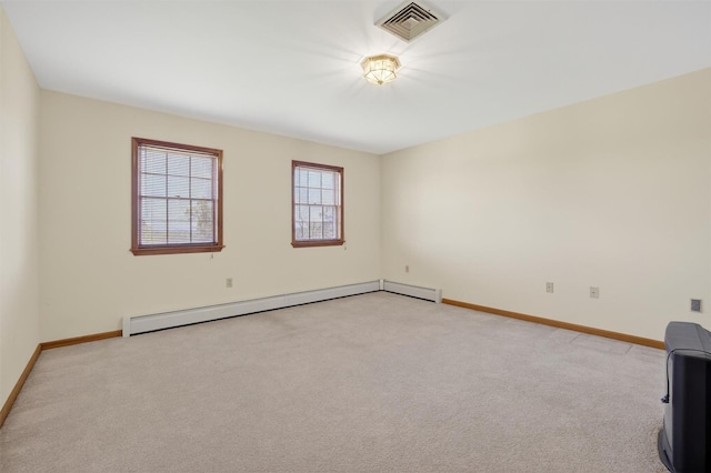 561 Toleman Rd, Rock Tavern, NY 12575 - empty room featuring a baseboard heating unit and light colored carpet