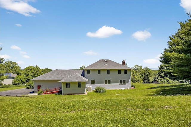 561 Toleman Rd, Rock Tavern, NY 12575 - back of house with a chimney and a yard