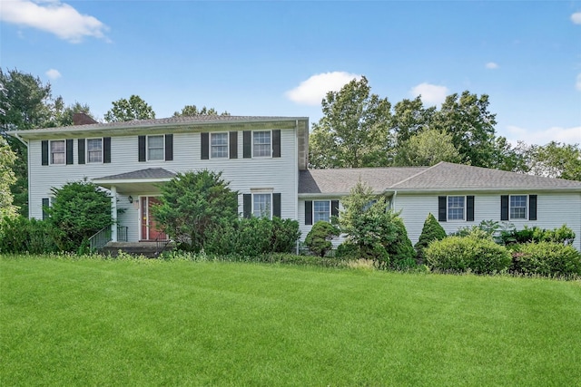 561 Toleman Rd, Rock Tavern, NY 12575 - colonial-style house featuring a front yard and a chimney