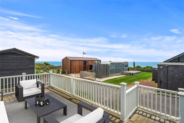 100 Deforest Rd Unit 701, Montauk, NY 11954 - wooden deck featuring a water view and a shed