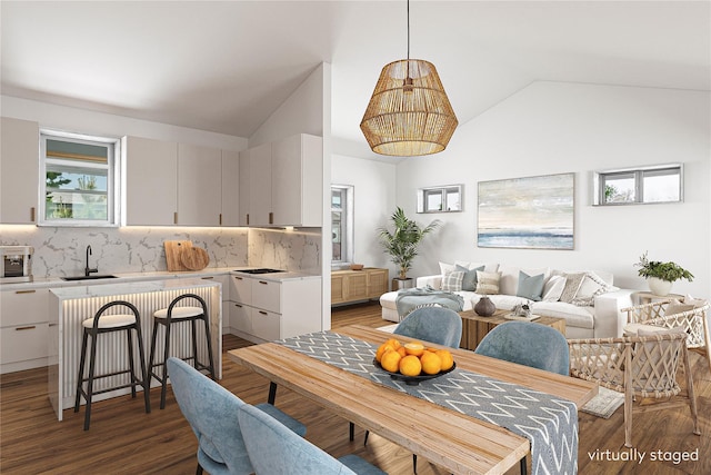 100 Deforest Rd Unit 701, Montauk, NY 11954 - dining space featuring vaulted ceiling and light wood-style flooring