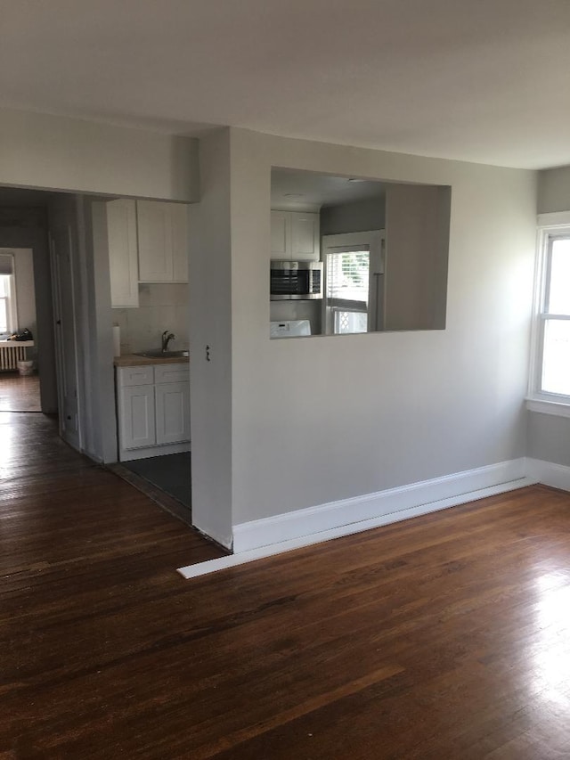 10 Dorothy Ct, South Merrick, NY 11566 - unfurnished room with dark wood-style floors