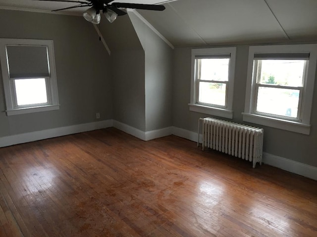 10 Dorothy Ct, South Merrick, NY 11566 - bonus room with radiator, a ceiling fan, lofted ceiling, plenty of natural light, and hardwood / wood-style floors