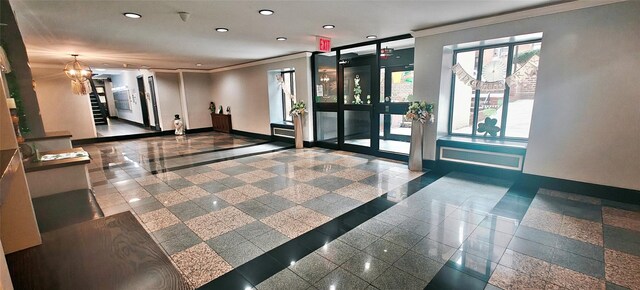 6615 Wetherole St Unit D12, Rego Park, NY 11374 - community lobby with ornamental molding and recessed lighting
