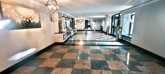 6615 Wetherole St Unit D12, Rego Park, NY 11374 - hall featuring crown molding and granite tiled floors