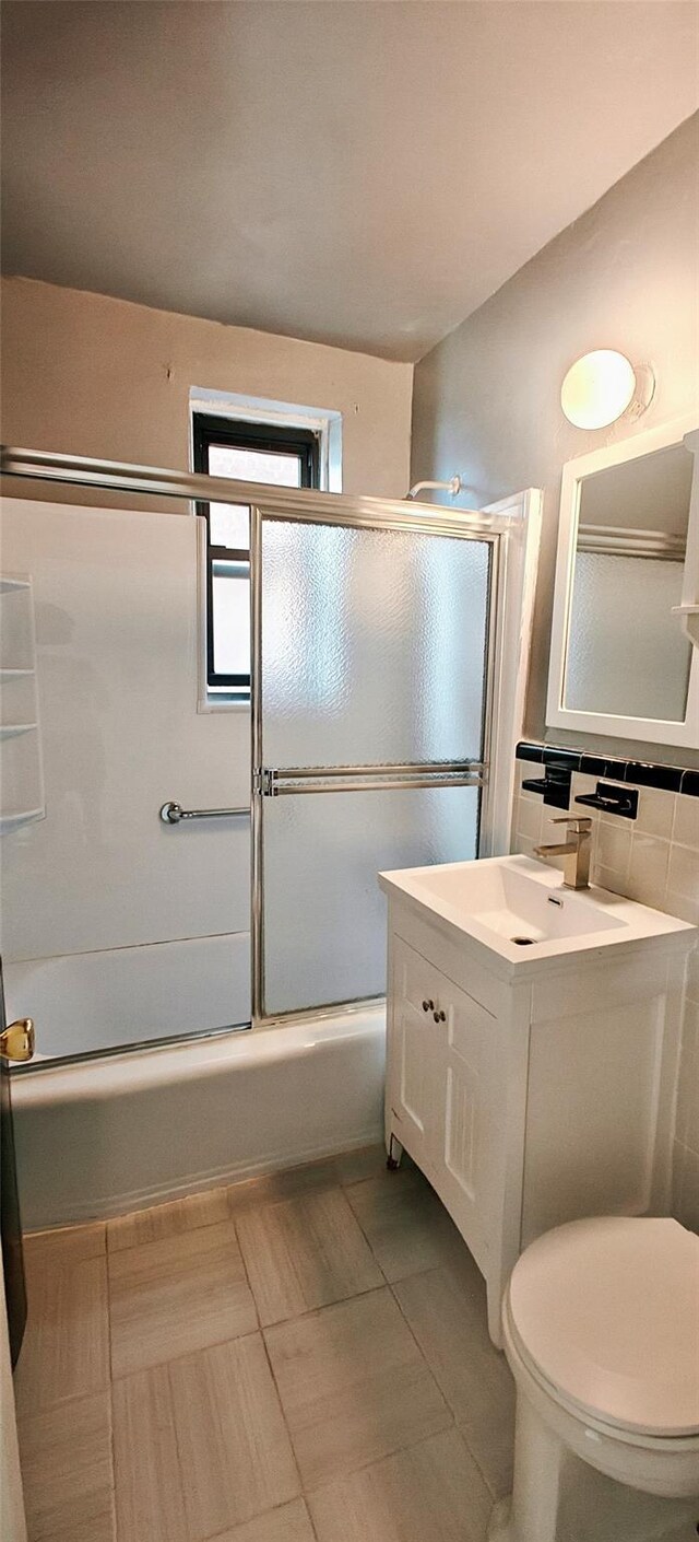 6615 Wetherole St Unit D12, Rego Park, NY 11374 - full bathroom with vanity, enclosed tub / shower combo, and tile patterned flooring