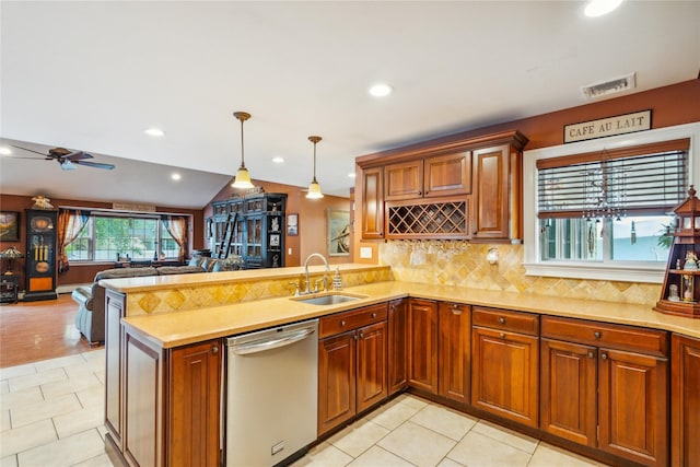1 Angelica Ct, West Babylon, NY 11704 - kitchen featuring stainless steel dishwasher, open floor plan, a peninsula, light countertops, and tasteful backsplash