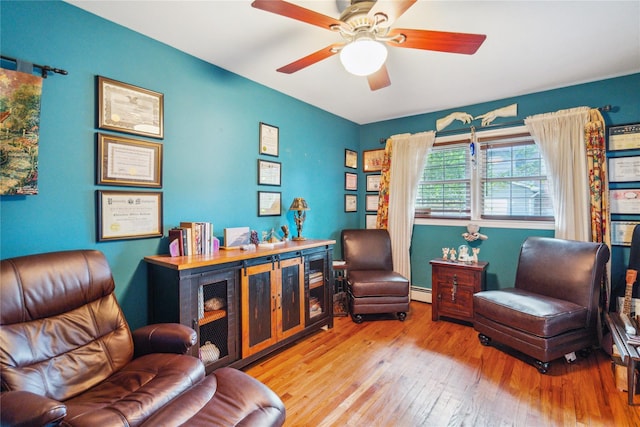 1 Angelica Ct, West Babylon, NY 11704 - office space featuring wood-type flooring, a ceiling fan, and a baseboard radiator