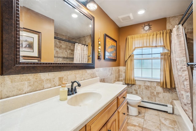 1 Angelica Ct, West Babylon, NY 11704 - full bathroom featuring baseboard heating, tile walls, vanity, and a wainscoted wall