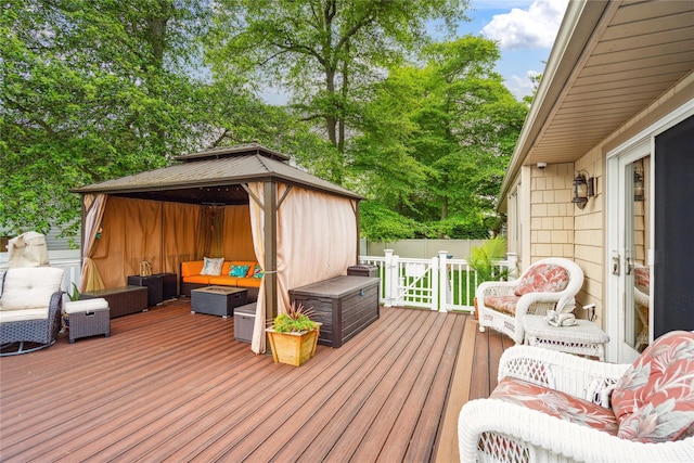 1 Angelica Ct, West Babylon, NY 11704 - deck with outdoor lounge area, a gazebo, and view of wooded area