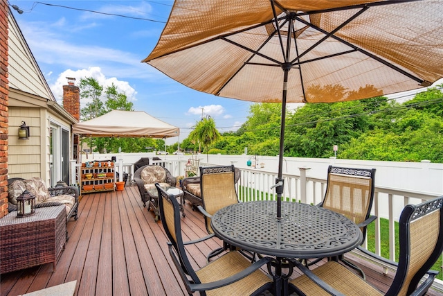 1 Angelica Ct, West Babylon, NY 11704 - wooden deck with outdoor dining area and a fenced backyard