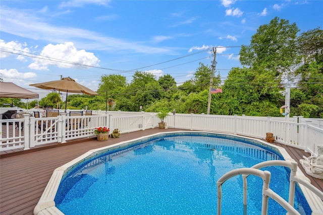 1 Angelica Ct, West Babylon, NY 11704 - view of swimming pool with a wooden deck and a fenced backyard