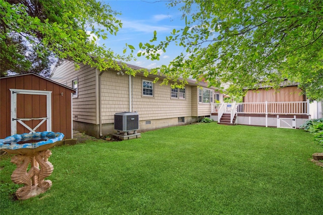 1 Angelica Ct, West Babylon, NY 11704 - view of green lawn featuring a shed and a wooden deck