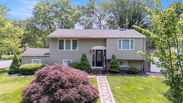 22 Pomper Dr, East Northport, NY 11731 - split foyer home with a front lawn and roof with shingles