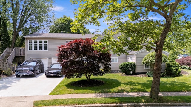 22 Pomper Dr, East Northport, NY 11731 - obstructed view of property with driveway, a front yard, an attached garage, and stairway