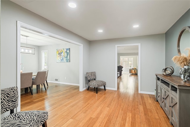22 Pomper Dr, East Northport, NY 11731 - living area featuring light wood finished floors, recessed lighting, and a chandelier