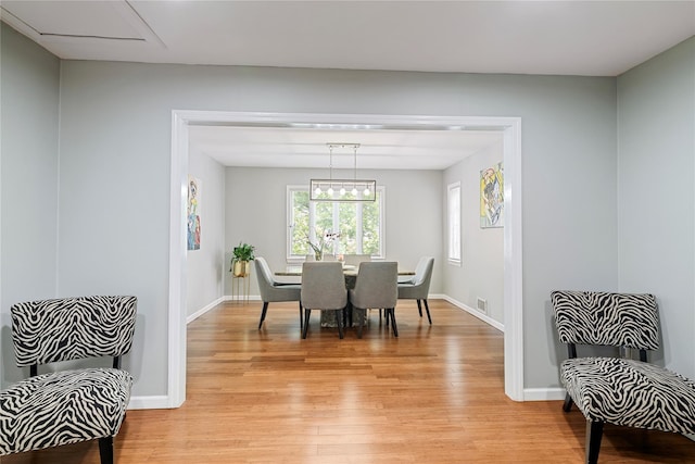 22 Pomper Dr, East Northport, NY 11731 - dining area with light wood-style floors and baseboards