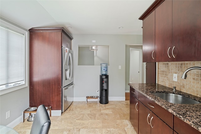22 Pomper Dr, East Northport, NY 11731 - kitchen with stainless steel refrigerator with ice dispenser, decorative backsplash, and dark stone counters