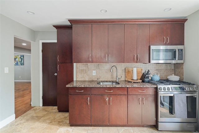 22 Pomper Dr, East Northport, NY 11731 - kitchen with appliances with stainless steel finishes, stone counters, decorative backsplash, and recessed lighting