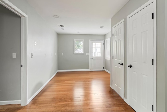 22 Pomper Dr, East Northport, NY 11731 - entrance foyer with baseboards and light wood-style flooring
