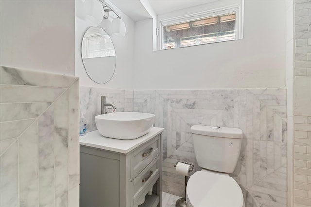 22 Pomper Dr, East Northport, NY 11731 - bathroom featuring tile walls, vanity, and a wainscoted wall