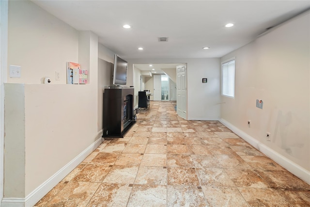 22 Pomper Dr, East Northport, NY 11731 - corridor with recessed lighting and light stone finish flooring
