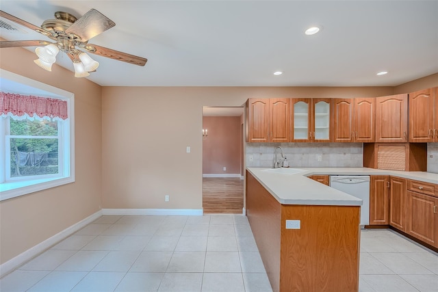 101 Wilson Dr, Port Jefferson Village, NY 11777 - kitchen featuring white dishwasher, ceiling fan, decorative backsplash, glass insert cabinets, and recessed lighting