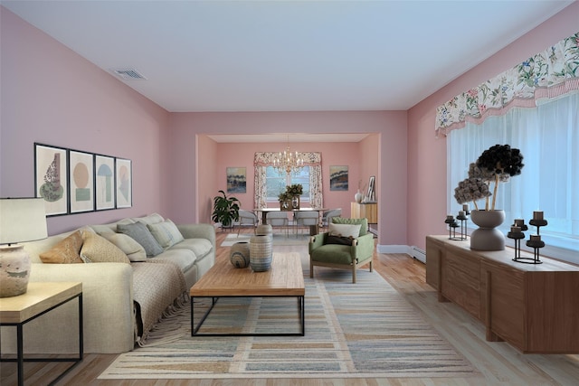 101 Wilson Dr, Port Jefferson Village, NY 11777 - living area with a chandelier and light wood finished floors