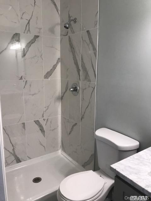 5 Fruitwood Ln, Commack, NY 11725 - bathroom with vanity and a shower stall