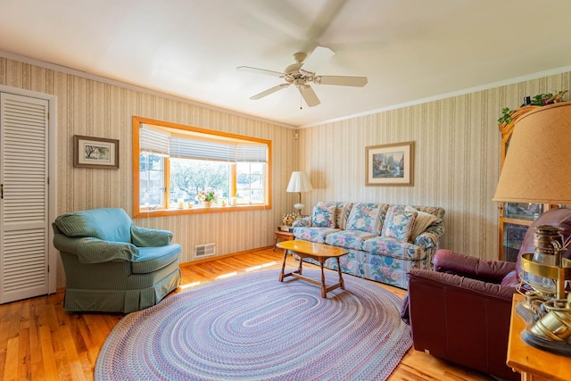 1668 Manatuck Blvd, Bay Shore, NY 11706 - living room with wood finished floors, crown molding, and a ceiling fan