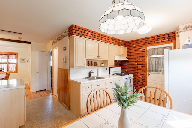 1668 Manatuck Blvd, Bay Shore, NY 11706 - kitchen featuring white appliances, under cabinet range hood, light countertops, brick wall, and open shelves