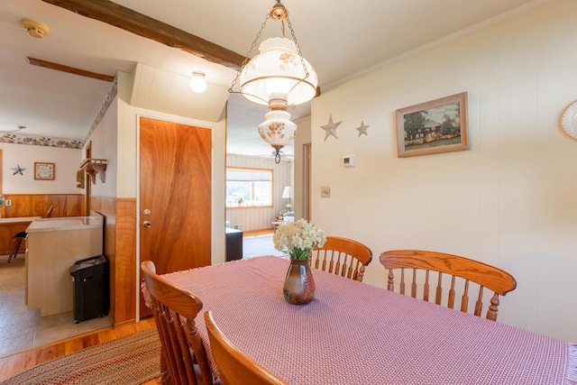 1668 Manatuck Blvd, Bay Shore, NY 11706 - dining space with light wood-style floors and wooden walls