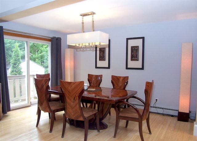 1778 Spur Dr S, Islip, NY 11751 - dining area featuring a chandelier, light wood-style floors, and a baseboard radiator