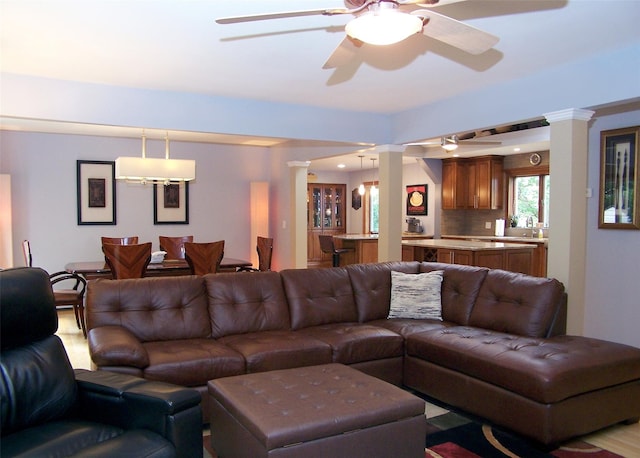 1778 Spur Dr S, Islip, NY 11751 - living area featuring decorative columns and ceiling fan