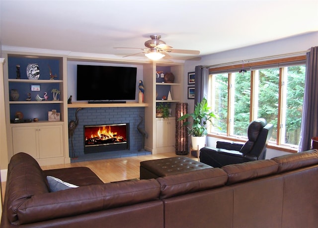 1778 Spur Dr S, Islip, NY 11751 - living area with a brick fireplace, ceiling fan, wood finished floors, and built in features