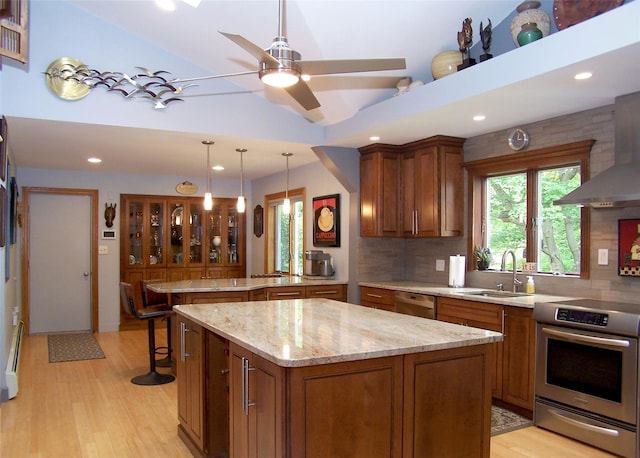 1778 Spur Dr S, Islip, NY 11751 - kitchen with appliances with stainless steel finishes, brown cabinets, backsplash, a peninsula, and recessed lighting