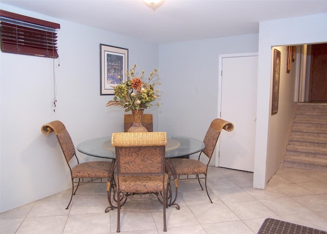 1778 Spur Dr S, Islip, NY 11751 - dining room with light tile patterned floors and stairway