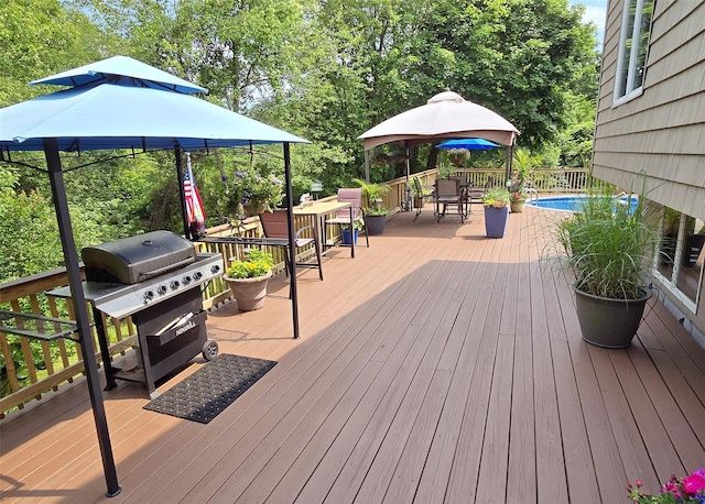 1778 Spur Dr S, Islip, NY 11751 - wooden terrace featuring outdoor dining space, grilling area, and a gazebo
