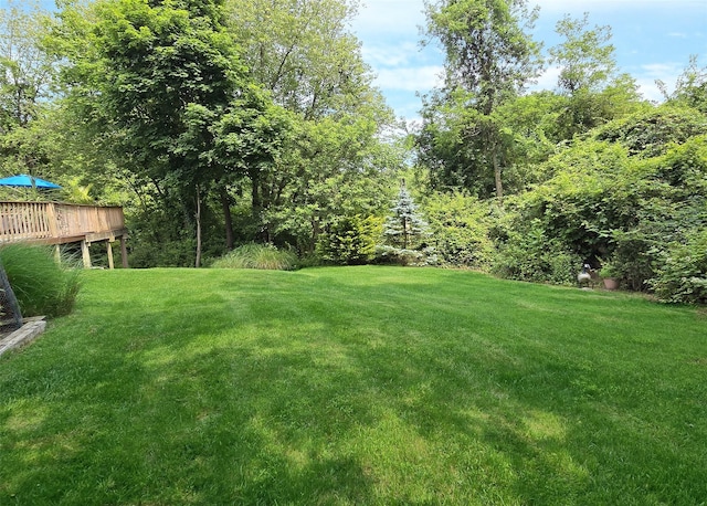 1778 Spur Dr S, Islip, NY 11751 - view of green lawn with a wooden deck
