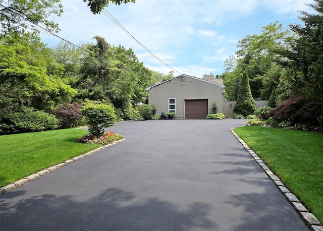 1778 Spur Dr S, Islip, NY 11751 - view of front of property featuring a garage and a front yard