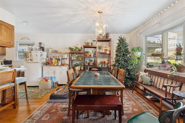 1222 Brook St, Peekskill, NY 10566 - dining space with light wood-style flooring and a chandelier