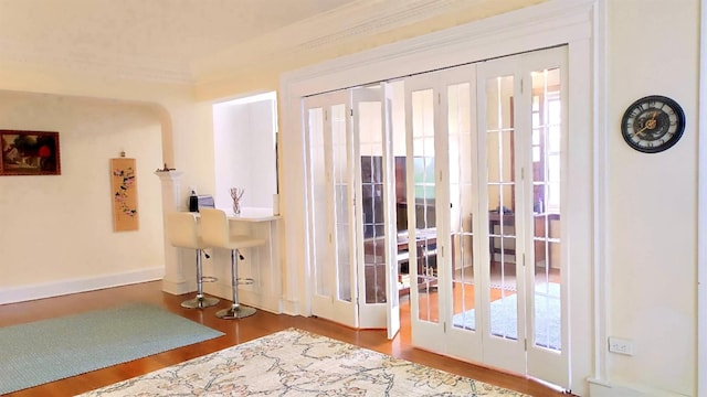 67-38 108st St Unit A53, Forest Hills, NY 11375 - entryway with french doors, wood finished floors, healthy amount of natural light, and crown molding