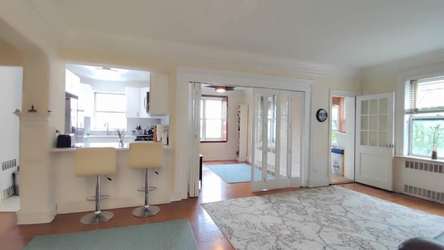 67-38 108st St Unit A53, Forest Hills, NY 11375 - entrance foyer with radiator heating unit and wood finished floors