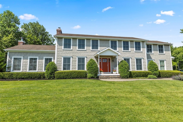 16 Dyke Rd, Setauket, NY 11733 - colonial house featuring a chimney and a front yard