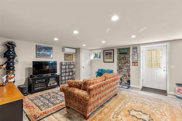 16 Dyke Rd, Setauket, NY 11733 - living room with a wall mounted AC, light wood-type flooring, and recessed lighting
