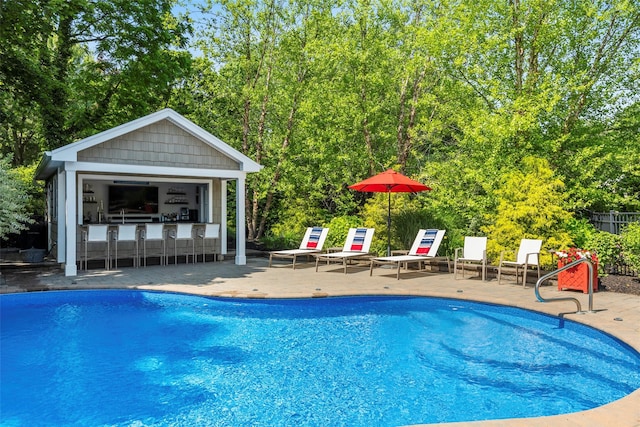 16 Dyke Rd, Setauket, NY 11733 - view of pool featuring a patio area, an outdoor structure, and view of scattered trees