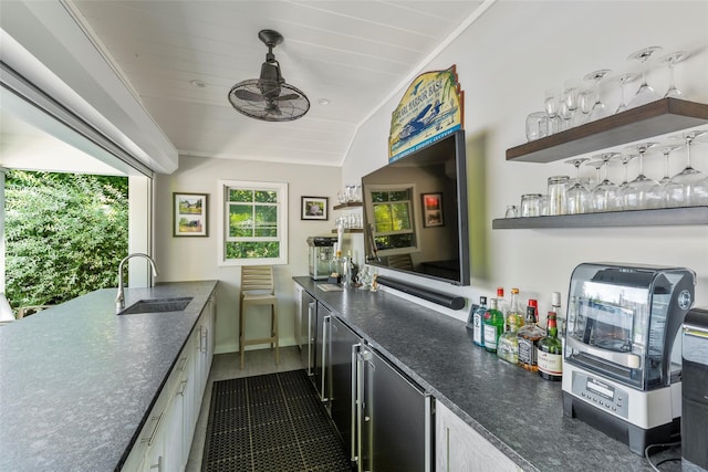 16 Dyke Rd, Setauket, NY 11733 - kitchen with vaulted ceiling, white cabinetry, refrigerator, and dark stone countertops